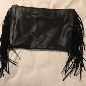 Oversized black clutch with fringe